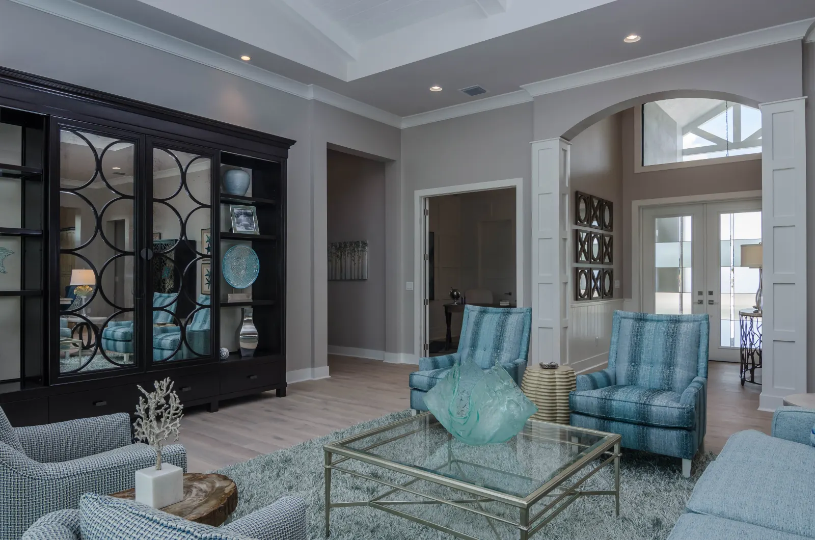 Living room foyer view at The Captiva Model, a custom home built by Marvin Homes in Naples, Florida