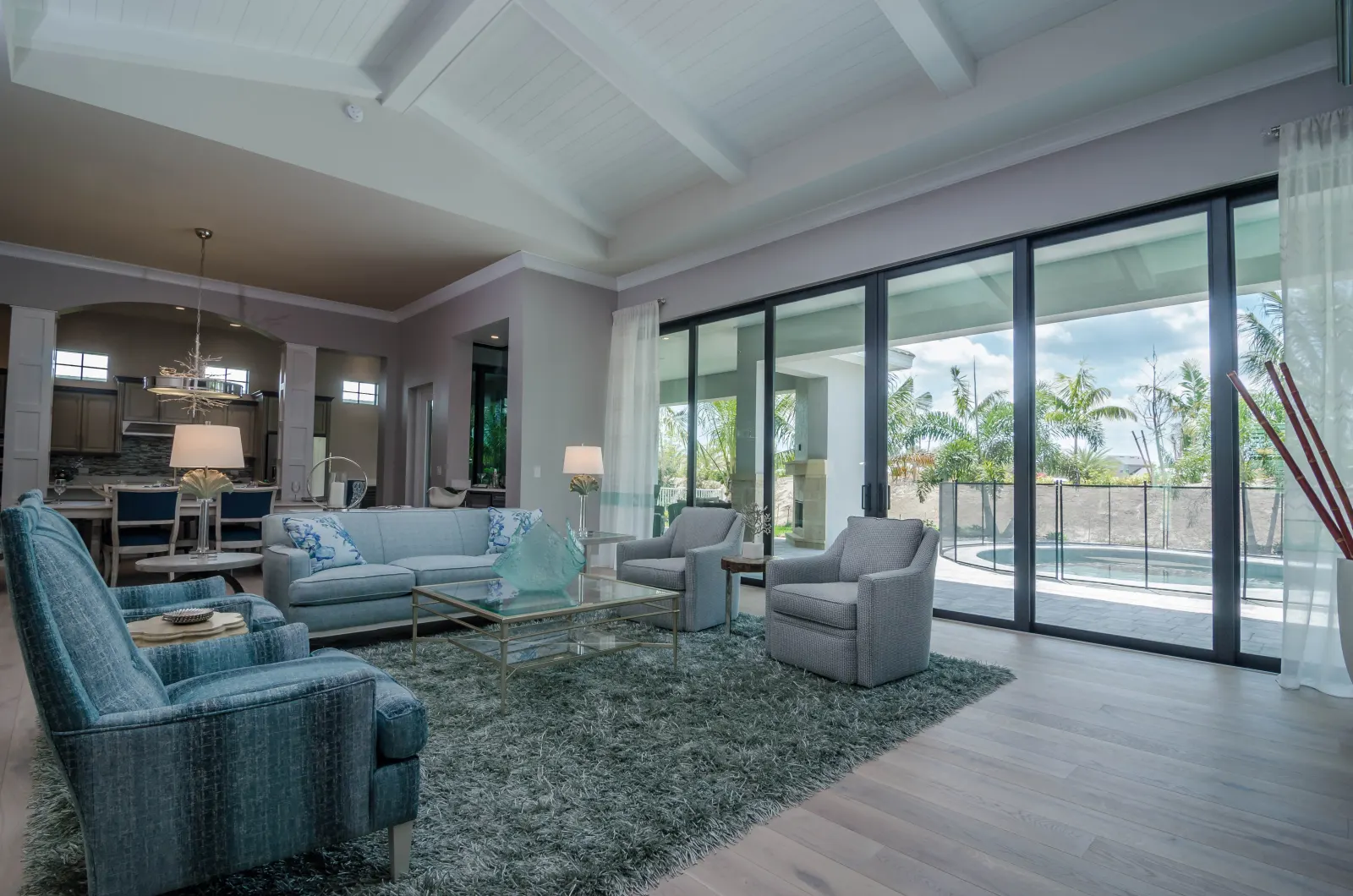 Living room kitchen view at The Captiva Model, a custom home built by Marvin Homes in Naples, Florida