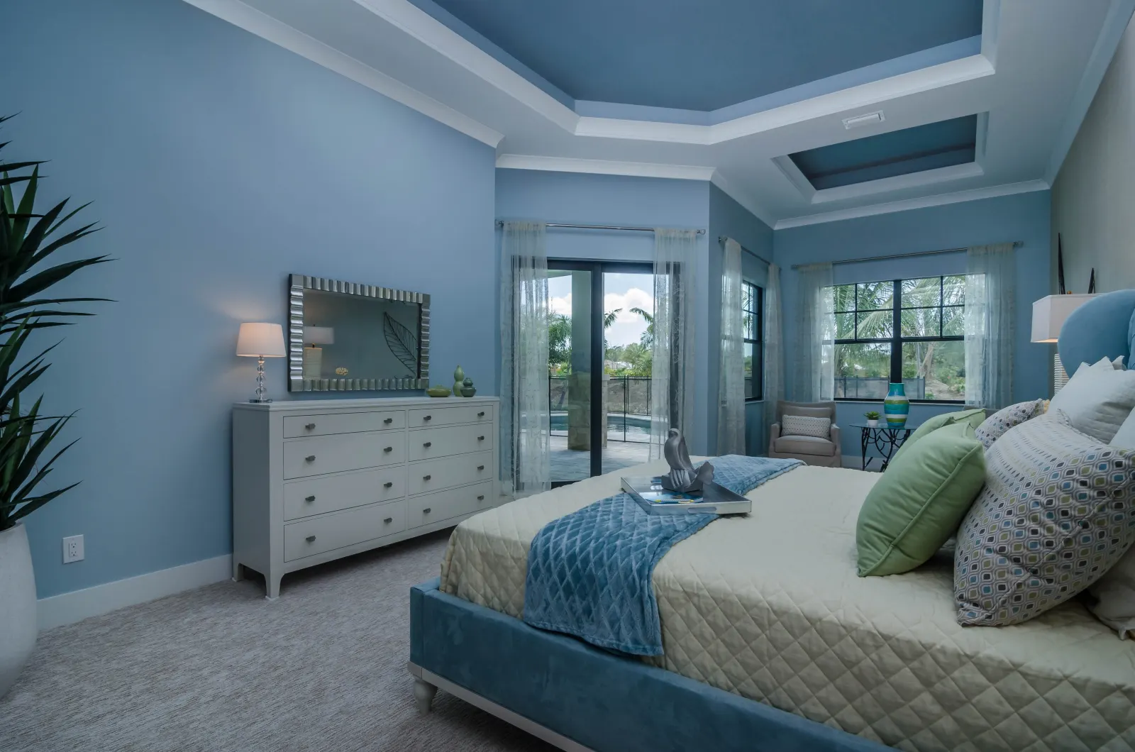 Master bedroom at The Captiva Model, a custom home built by Marvin Homes in Naples, Florida