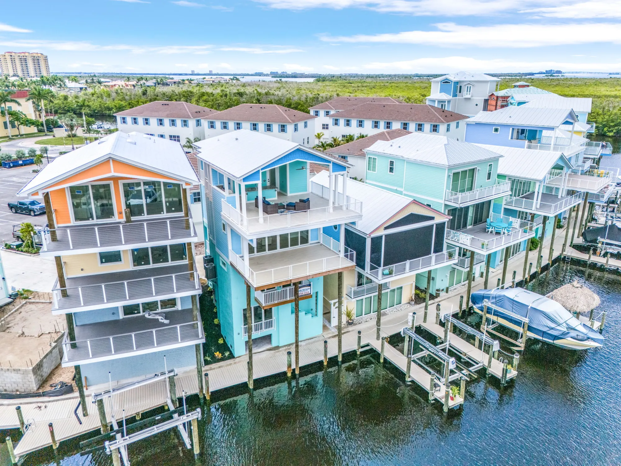 Exterior waterfront row — custom home built by Marvin Homes in Southwest Florida