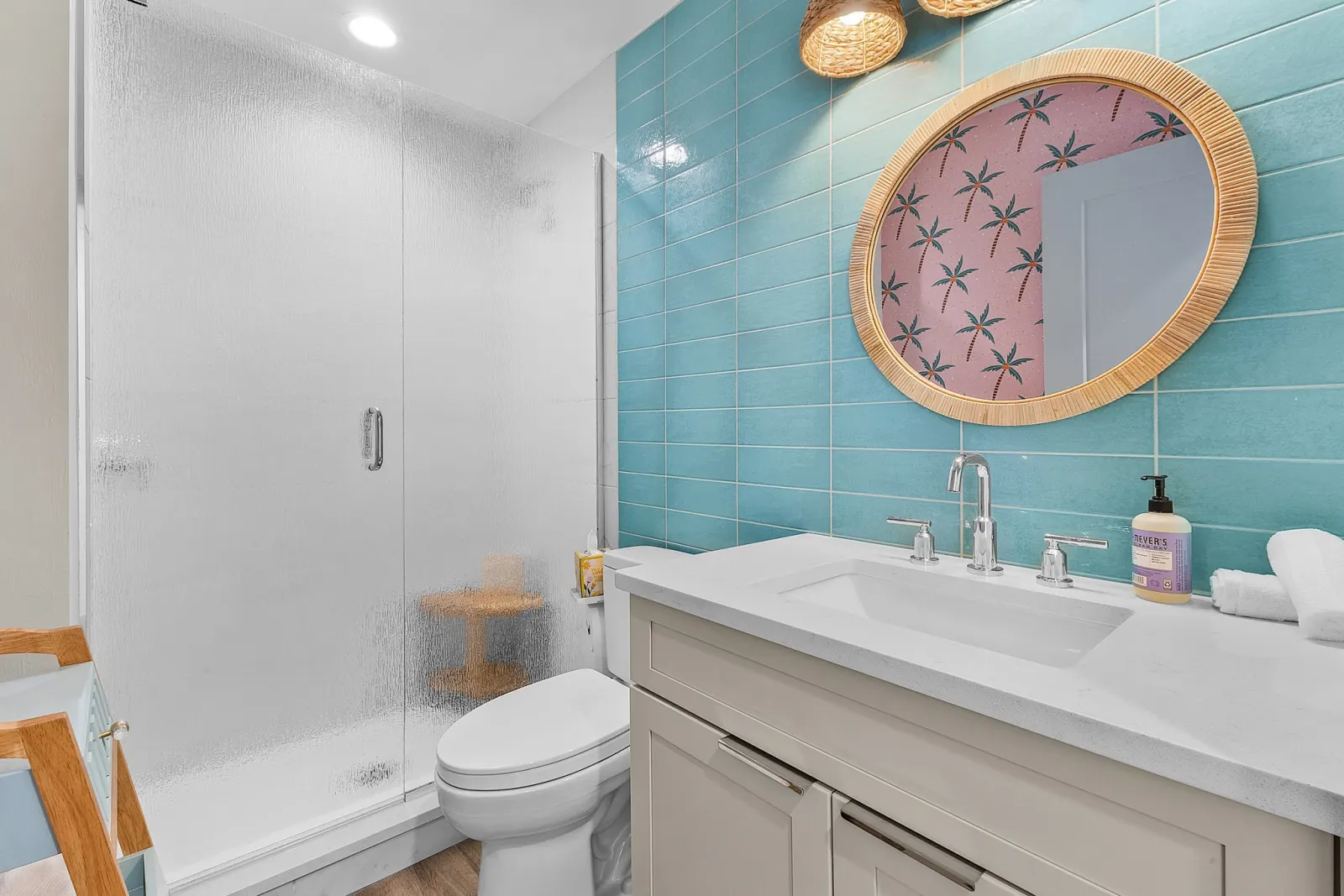 Bathroom teal tile at The Flamingo, a custom home built by Marvin Homes in Fort Myers Beach, Florida