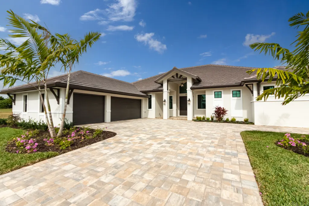 Exterior front symmetric at The Heron House, a custom home built by Marvin Homes in Naples, Florida