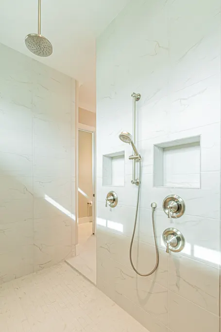 Primary bathroom shower at The Heron House, a custom home built by Marvin Homes in Naples, Florida