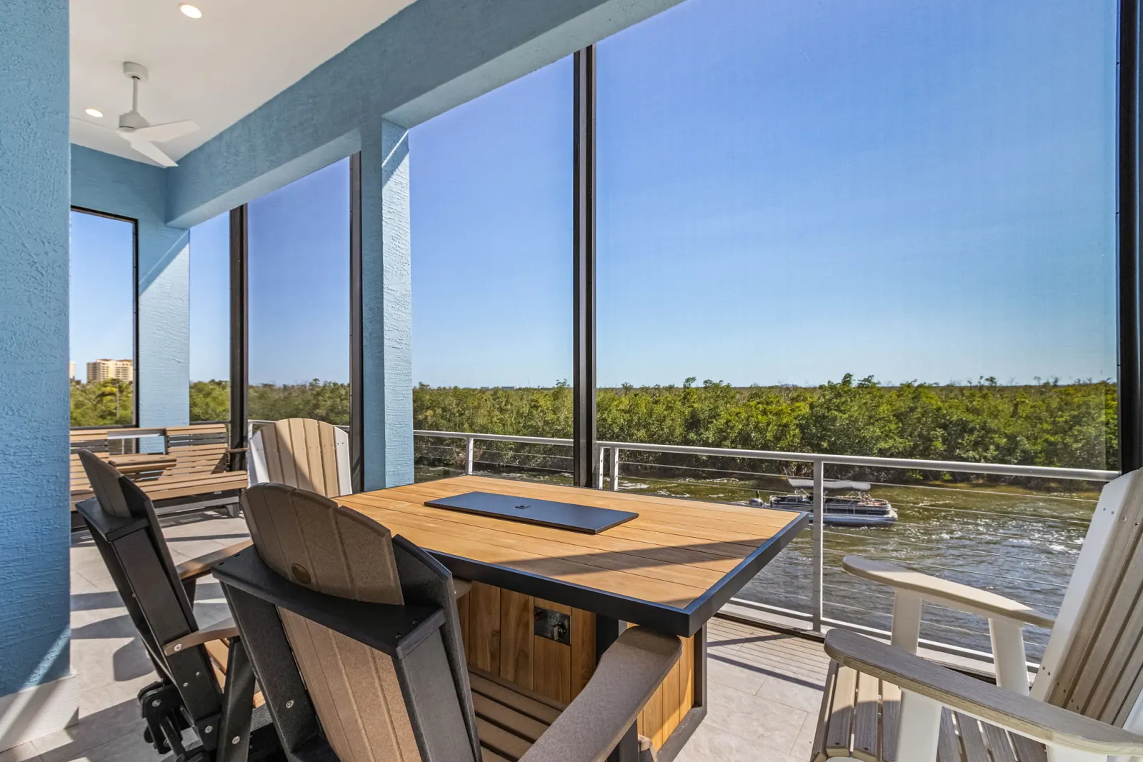 Balcony dining firepit at The Marlin, a custom home built by Marvin Homes in Cape Coral, Florida
