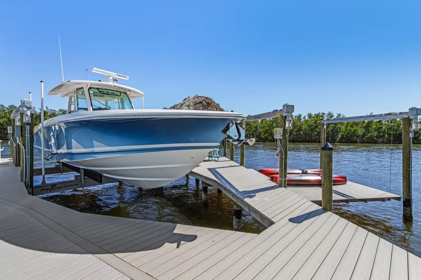 Dock boat lift at The Marlin, a custom home built by Marvin Homes in Cape Coral, Florida