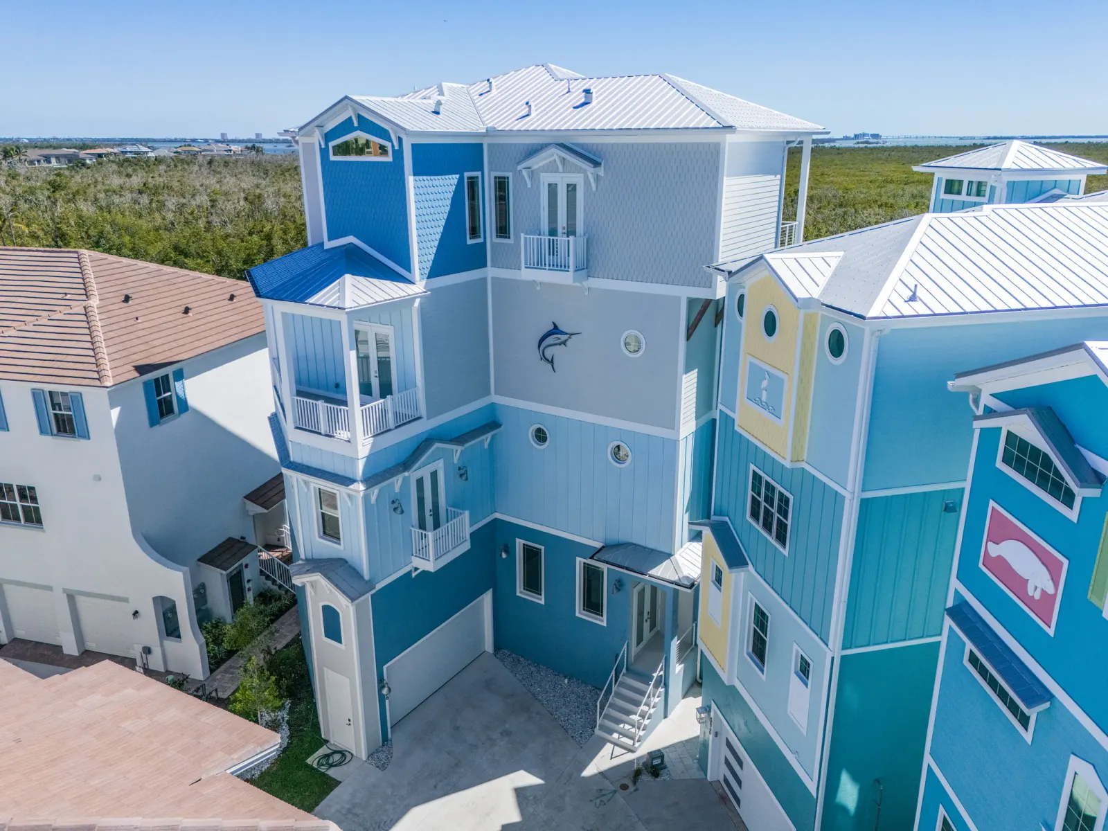 Exterior aerial marlin logo at The Marlin, a custom home built by Marvin Homes in Cape Coral, Florida