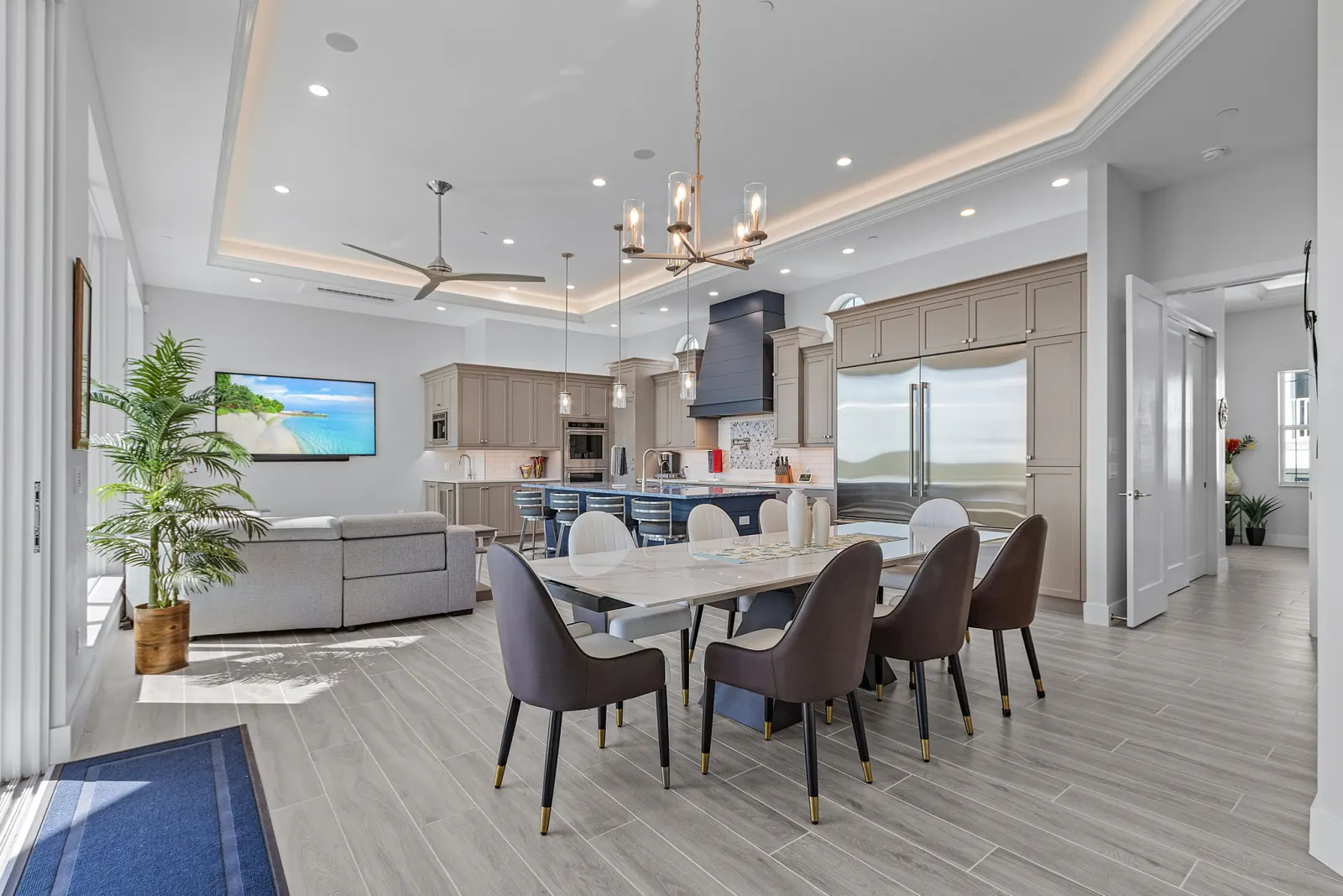 Kitchen dining living open concept at The Marlin, a custom home built by Marvin Homes in Cape Coral, Florida