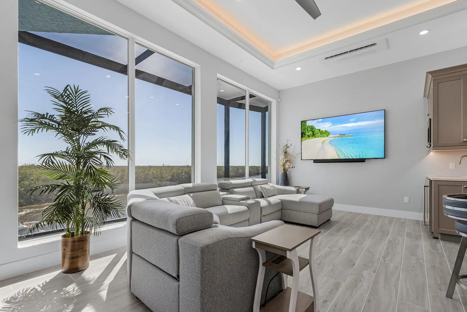 Living room sectional tv at The Marlin, a custom home built by Marvin Homes in Cape Coral, Florida