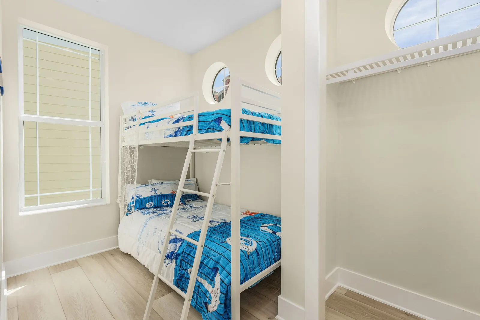 Bedroom bunk nautical at The Octopus, a custom home built by Marvin Homes in Cape Coral, Florida