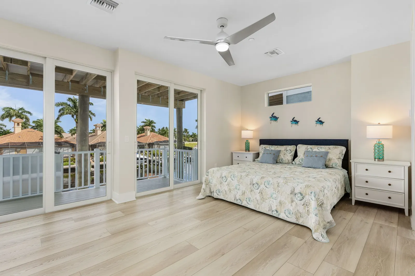 Primary bedroom turtle art at The Octopus, a custom home built by Marvin Homes in Cape Coral, Florida