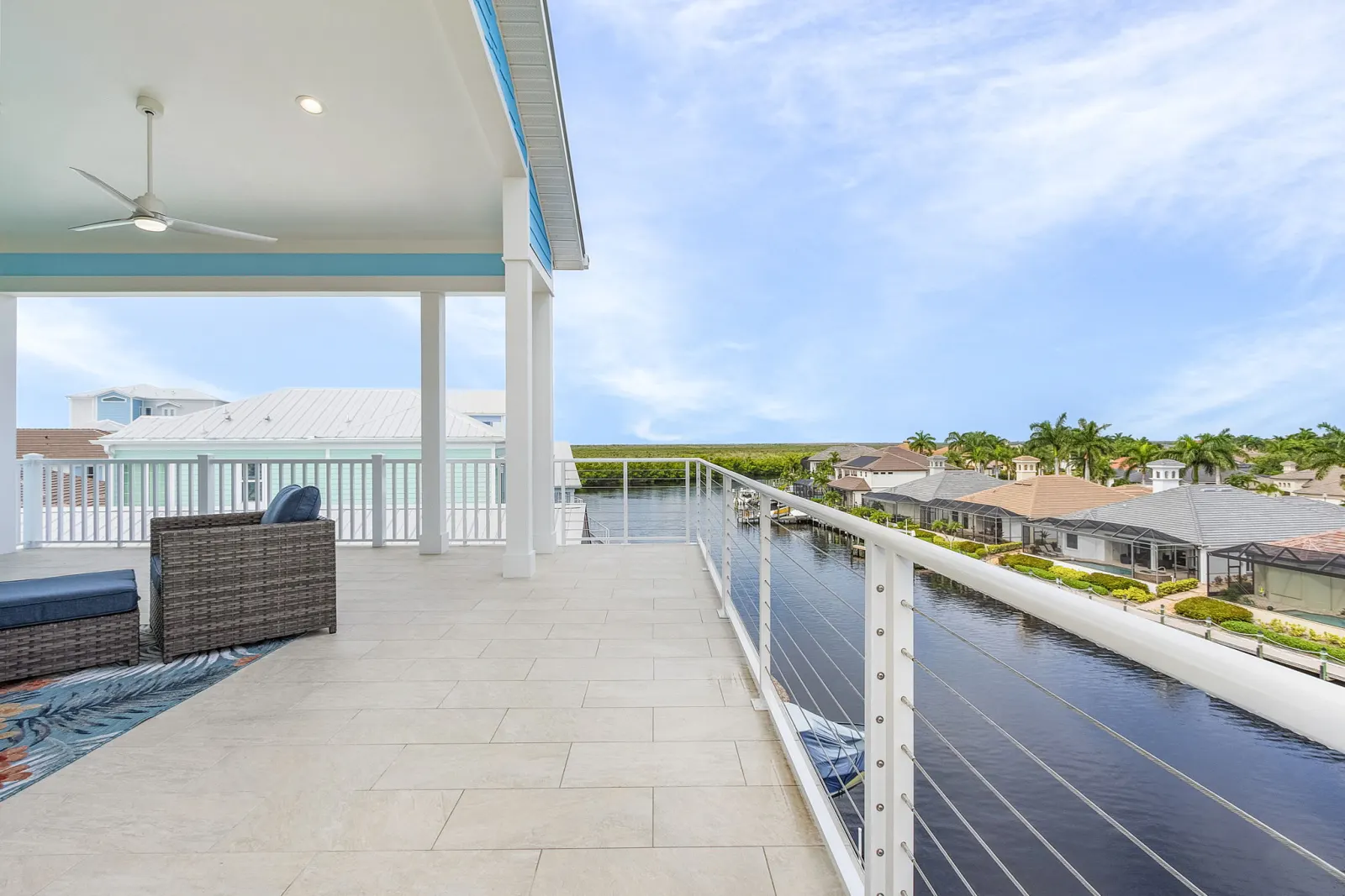 Rooftop deck lounge dock view at The Octopus, a custom home built by Marvin Homes in Cape Coral, Florida