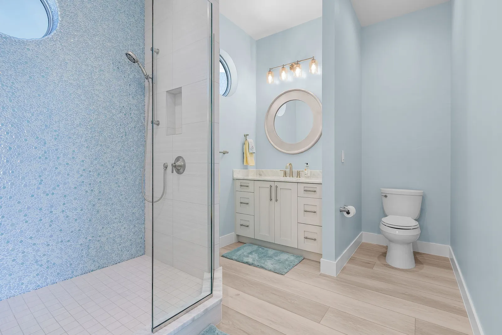 Bathroom shower vanity toilet at Pelican's Perch, a custom home built by Marvin Homes in Cape Coral, Florida