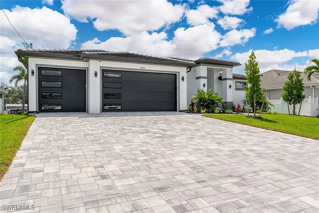 Exterior front at Sturgeon's Landing, a custom home built by Marvin Homes in Cape Coral, Florida
